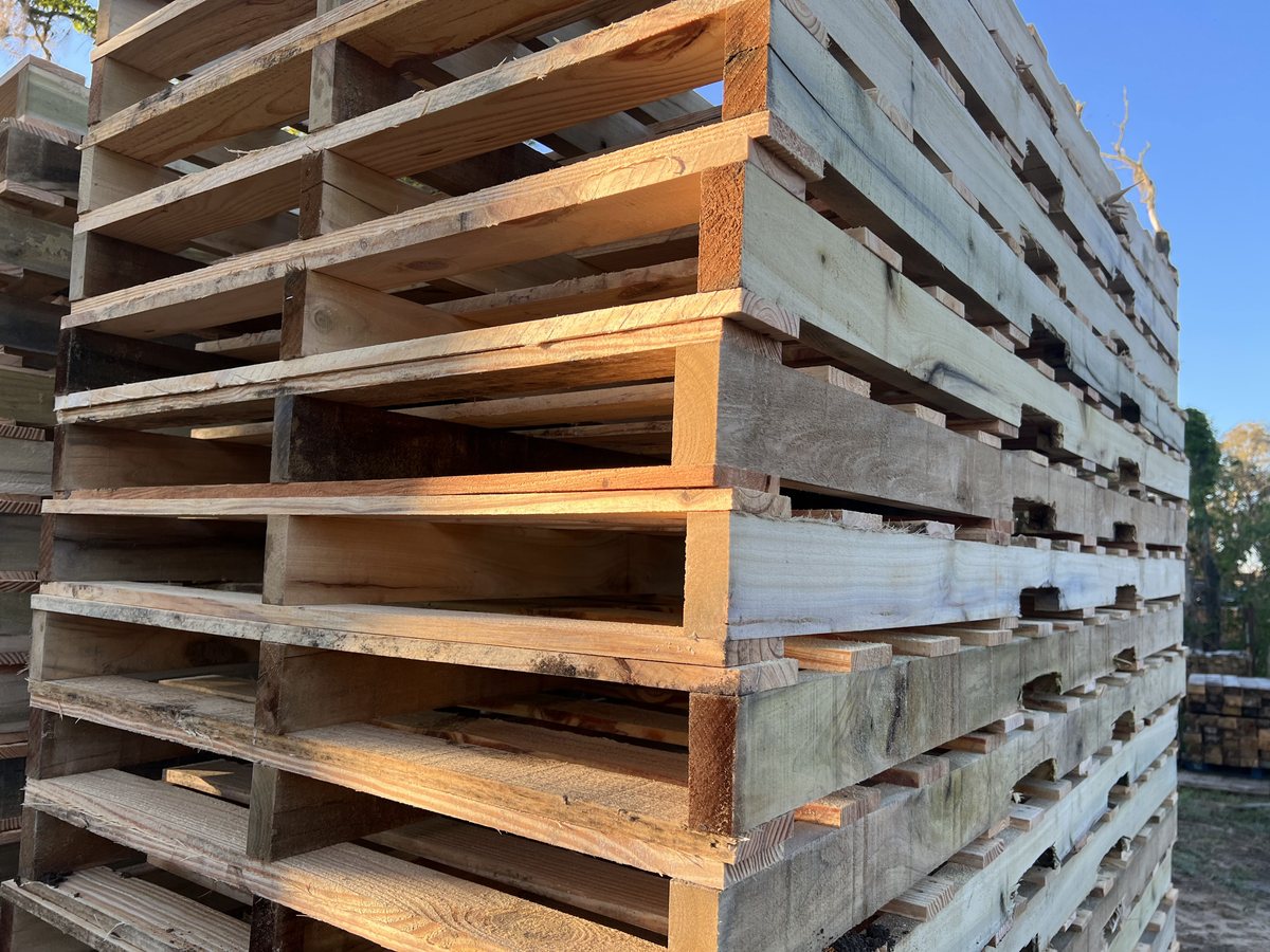 New southern yellow pine GMA pallets stacked at Florida pallet supply yard