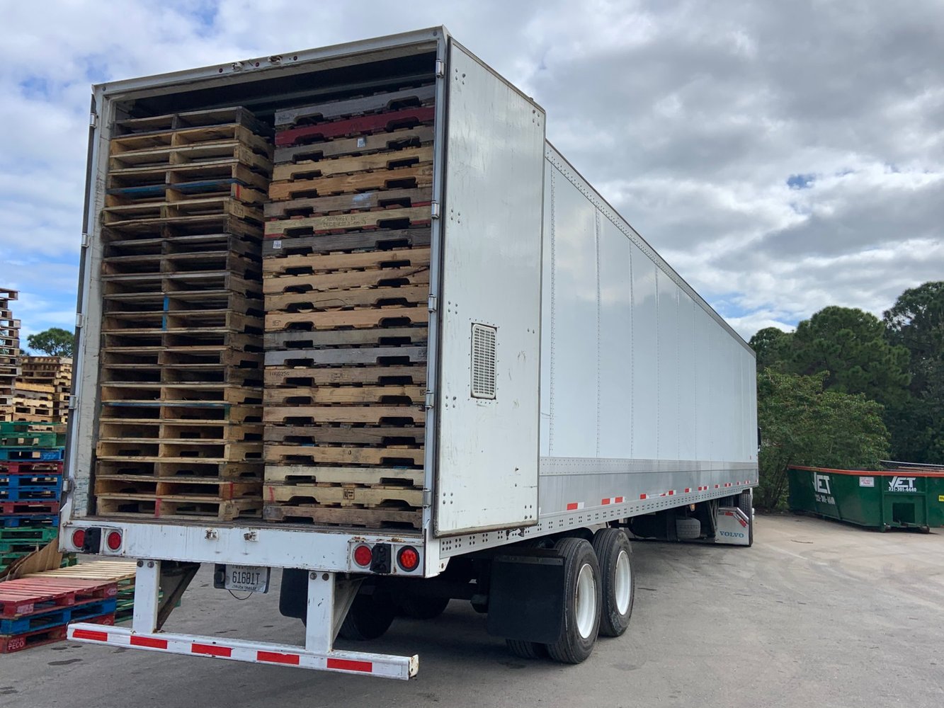 Drop trailer with pallets at yard